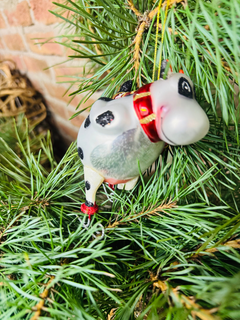 Baumanhänger Kuh auf Schlittschuhen