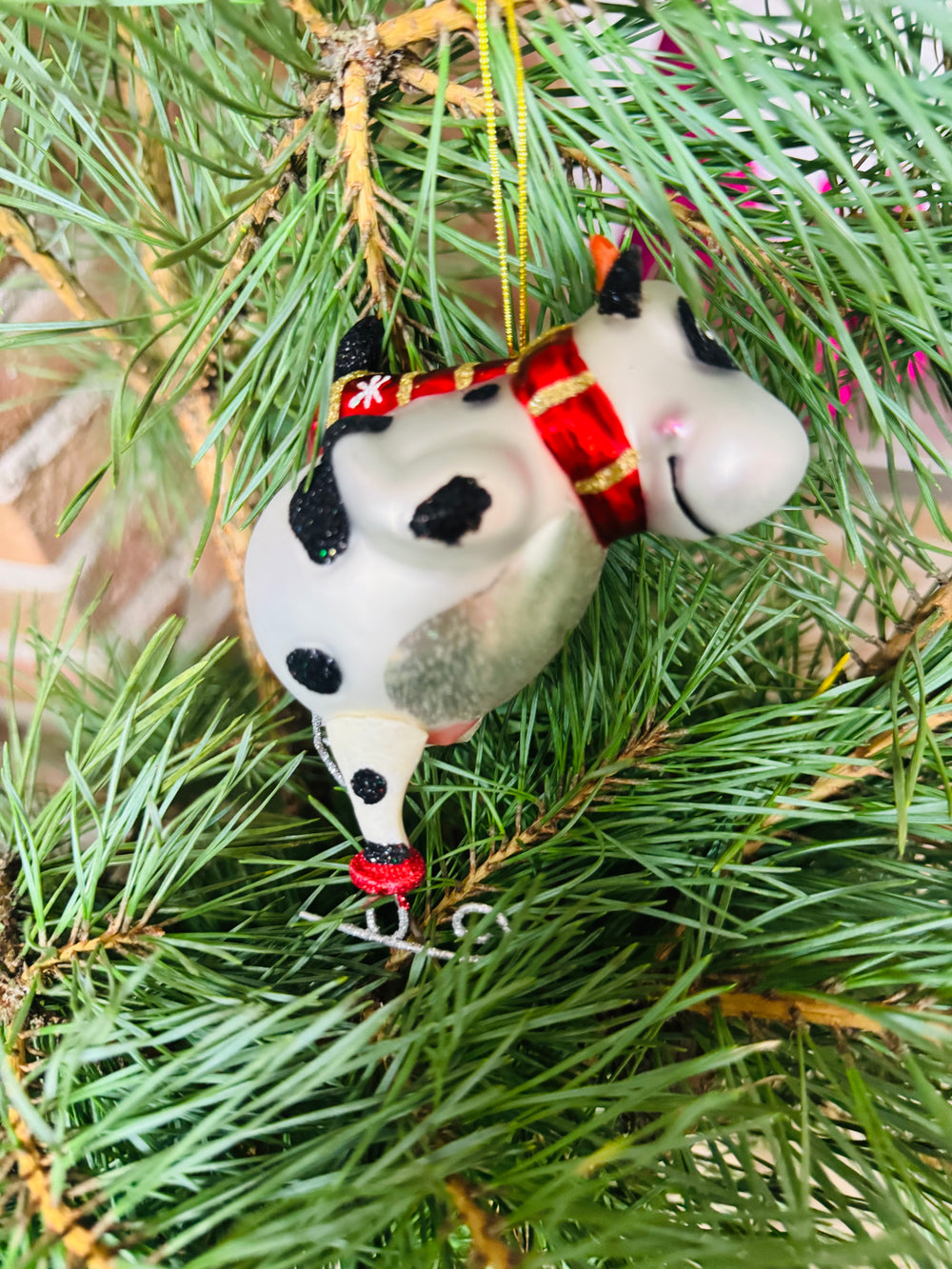 Baumanhänger Kuh auf Schlittschuhen