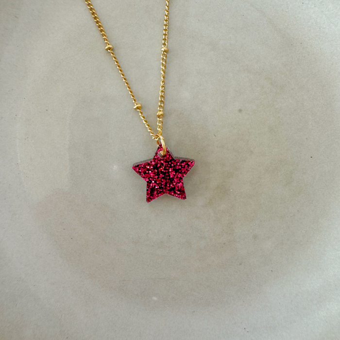 Lumen Charm Halskette gold/Stern magenta